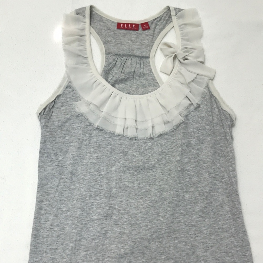 Grey top with white ruffles